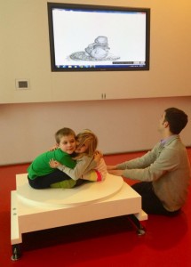 Figure 1: young visitors at the Art Institute pose like a statue to be modeled in 3D using a Microsoft Kinect and ReconstructMe.