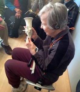 Figure 2: a visitor with sight impairment 'sees' the collection object by touching a 3D-printed replica.