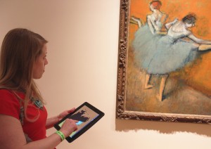 Visitor creating digital work of art using Lite-Brite iPad app during a Phillips after 5