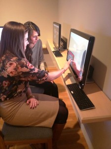 Visitors using uCurate in the Made in the USA exhibition at the Phillips