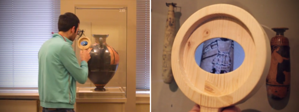 Figure 2: Unveiling hidden stories of objects at the Allard Pierson Museum. (Amsterdam) in a non-intrusive way. The visitor is not aware he is using the optical zoom of a smart-phone encased within the wooden magnifying glass.